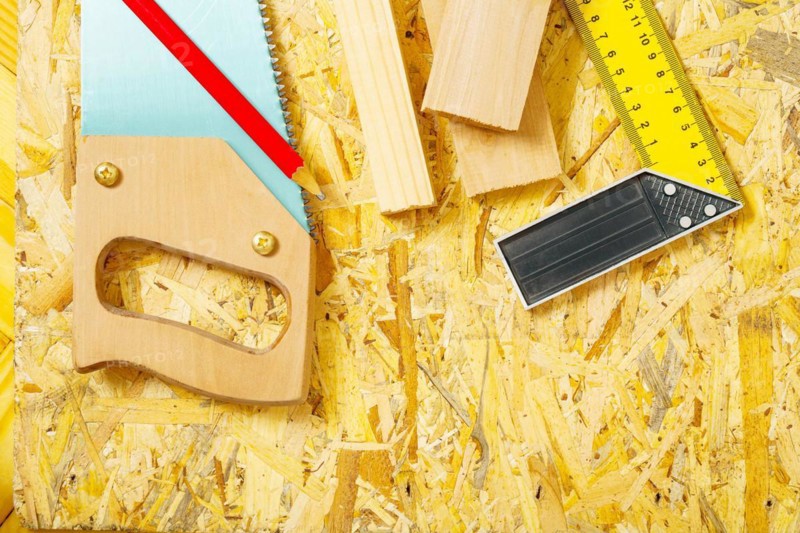 Carpentry tools on plywood panel