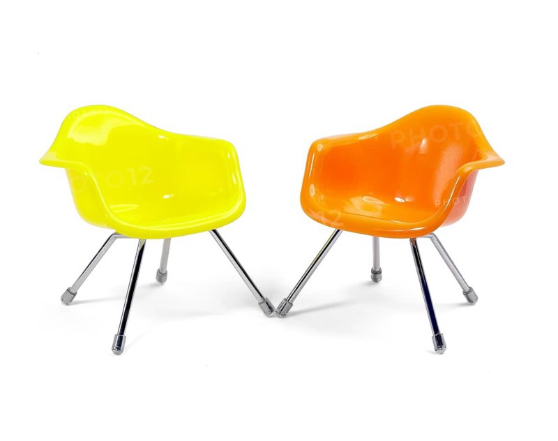 Coulored plastic chairs isolated on white background