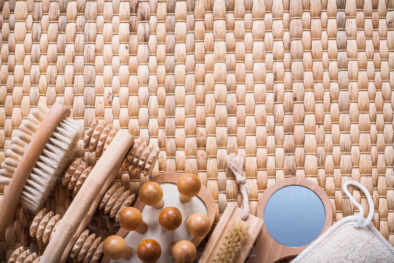 Horizontal view of sauna articles on a wicker mat Health concept