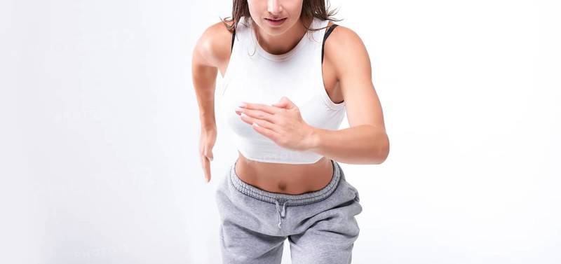 No name portrait. Sports woman runner on a white background. Photo of an attractive woman in fashionable sportswear. Dynamic movement. Side view. Sports and healthy lifestyle. Mixed media
