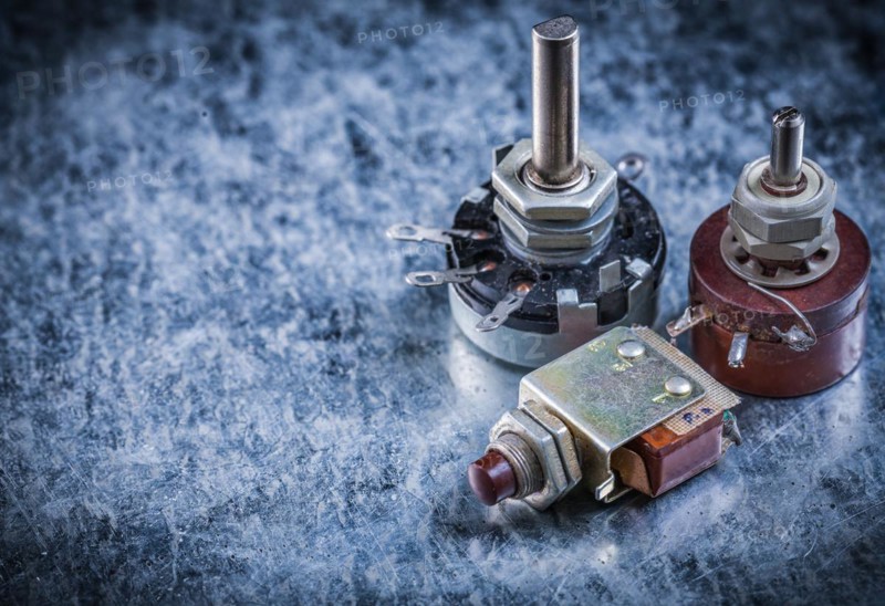 Electric toggles on metallic surface top view electricity concept
