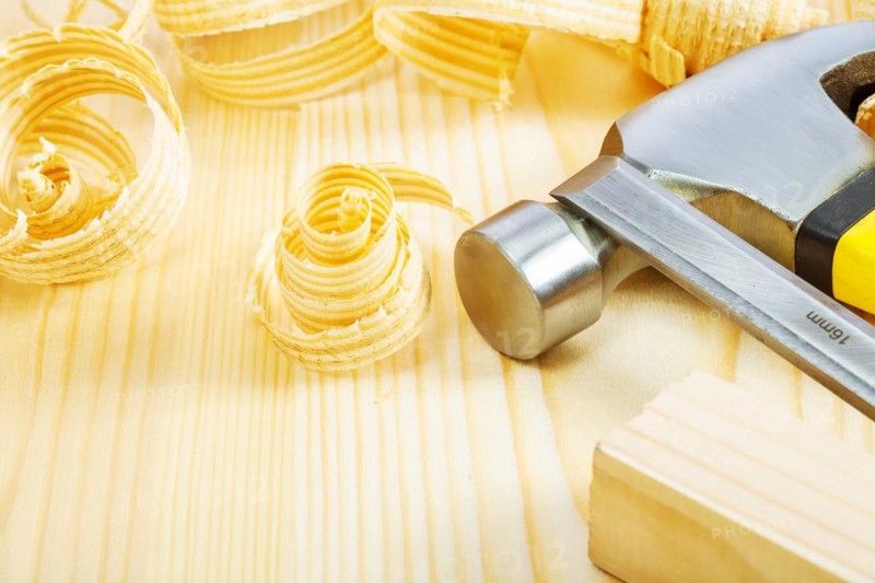 Hammer and chisel on boards