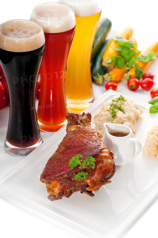 Original German BBQ pork knuckle served with mashed potatoes and sauerkraut
