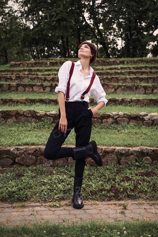 Image of a stylish beautiful woman in a white shirt