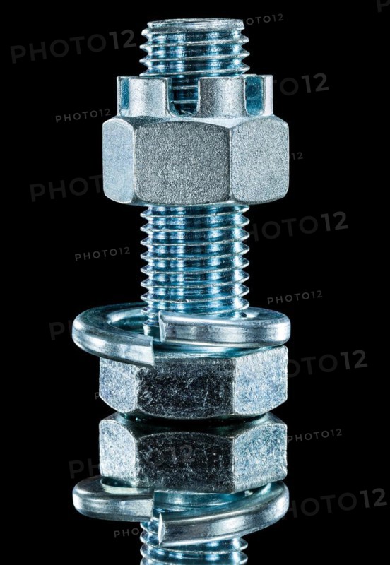 Construction nut screwbolt spring washer on black surface