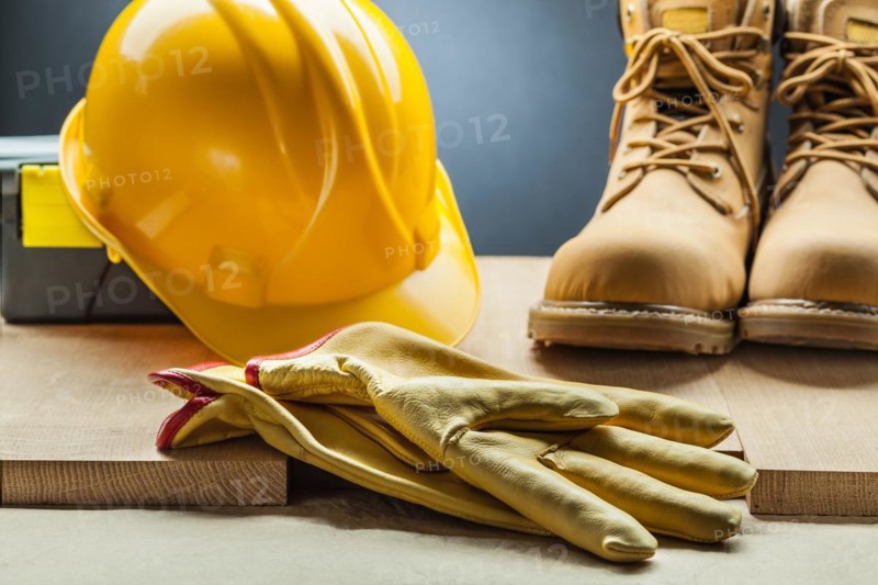 Yellow leather gloves working boots construction helmet toolbox