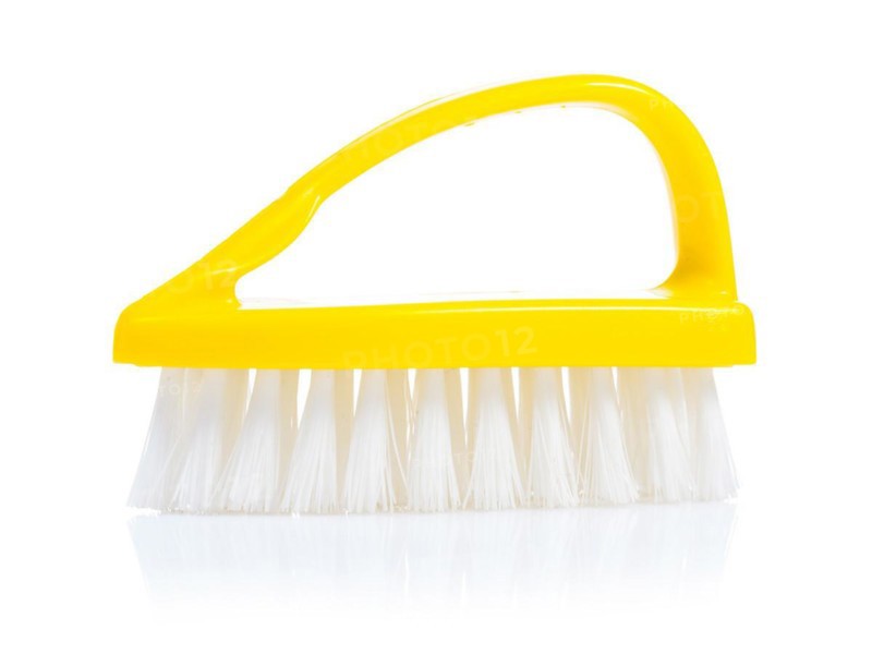 A yellow kitchen scrubber against a white background
