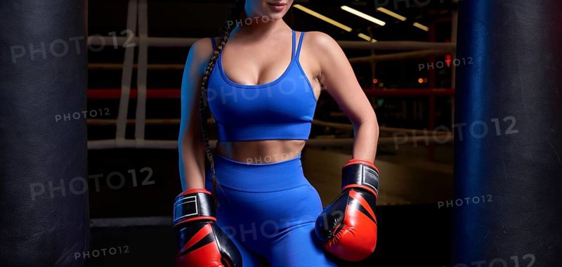 Woman boxer in red gloves. Sports concept
