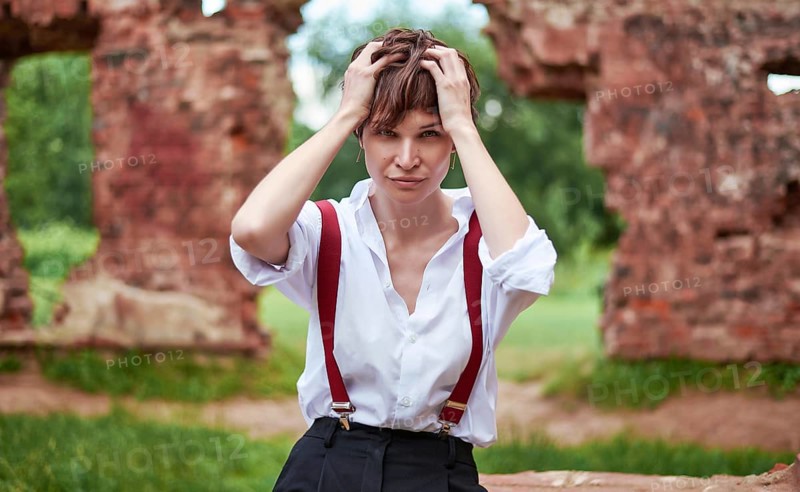 Image of a stylish beautiful woman in a white shirt