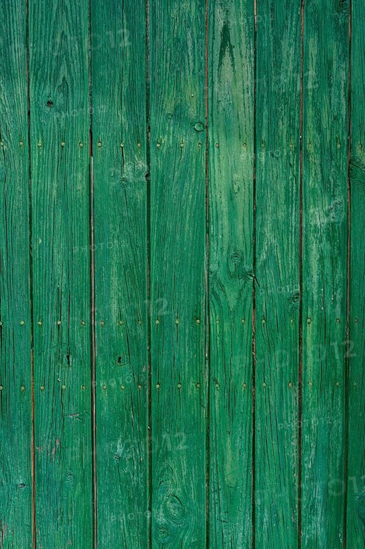 Old wooden door with aged metal door handle. Architectural textured background