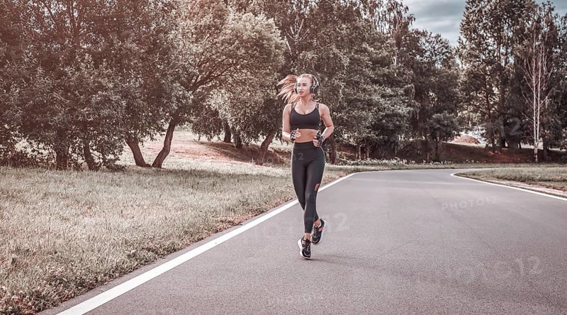 Sports girl jogging in the park. The concept of a healthy lifestyle. Sports Equipment. Fitness style advertisement. mixed media