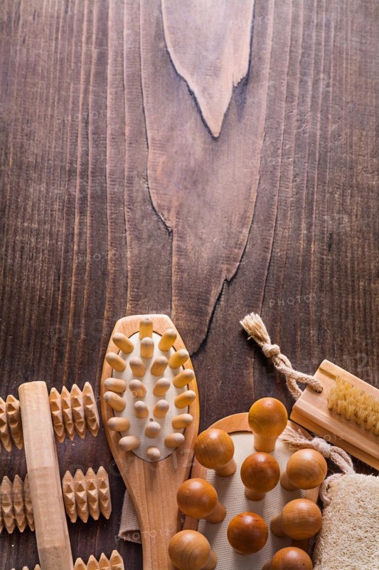 Classic wooden massagers on vintage wooden board with copy surface