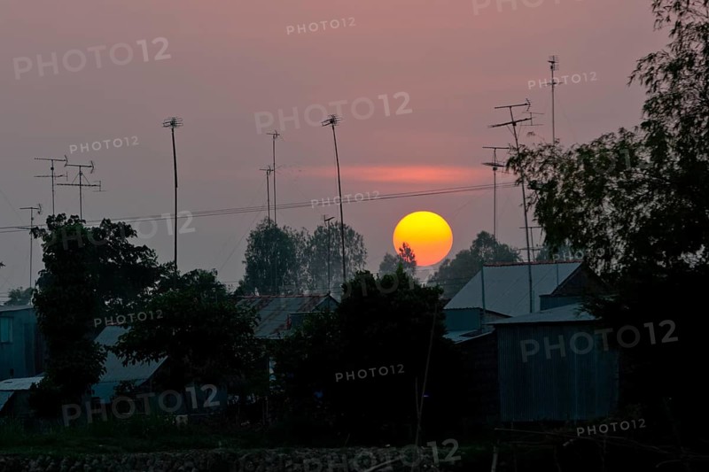 Sunset behind roofs and old television aerials