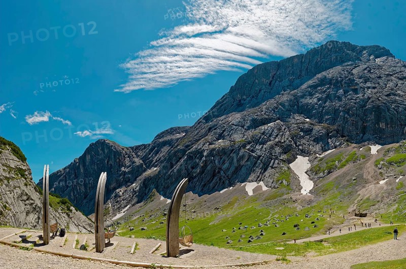 Mountain landscape with blue sky and foehn clouds