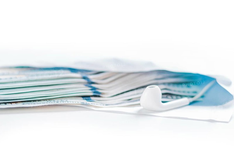 Pack of hundred-dollar bills along with a bug lie in an envelope. The concept of bribery and corruption.