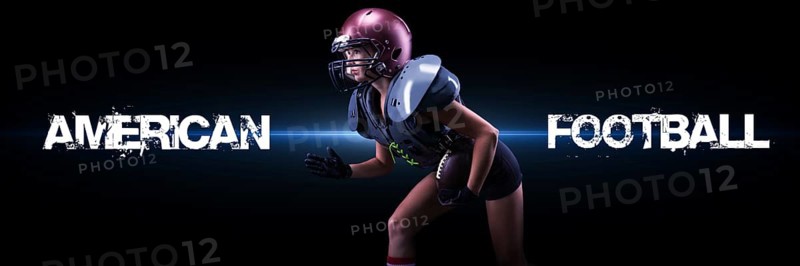 Image of a girl in the uniform of an American football team player. She runs with the ball against the background of light spots. Sports concept. Shoulders pads.