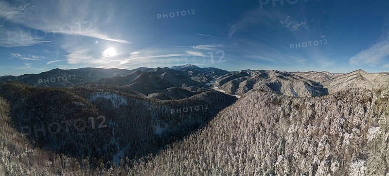 Aerial view of the Schneeberg over the snow-covered landscape near the chapel of the seven holy fathers