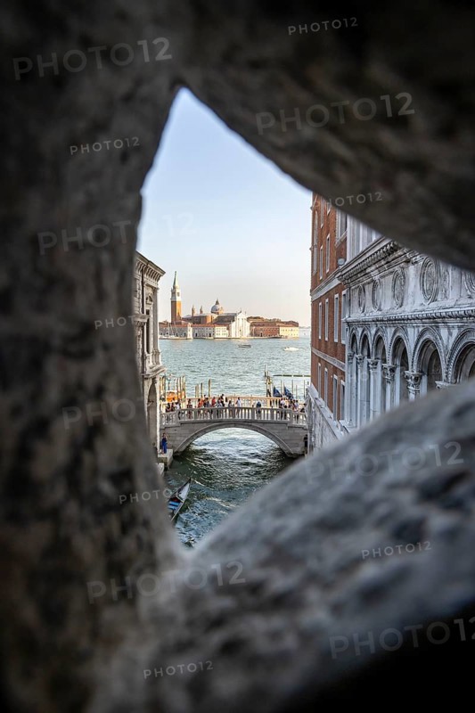 View from the Bridge of Sighs through a small hatch