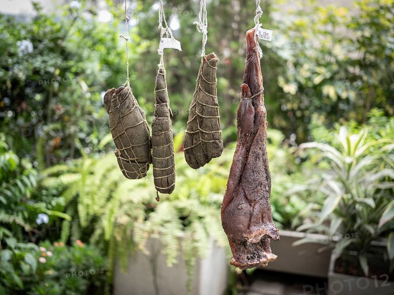 Llama shanks and leg of lamb over a smoker