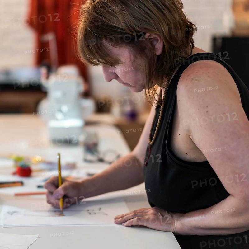 A fashion designer drawing a fashion sketch