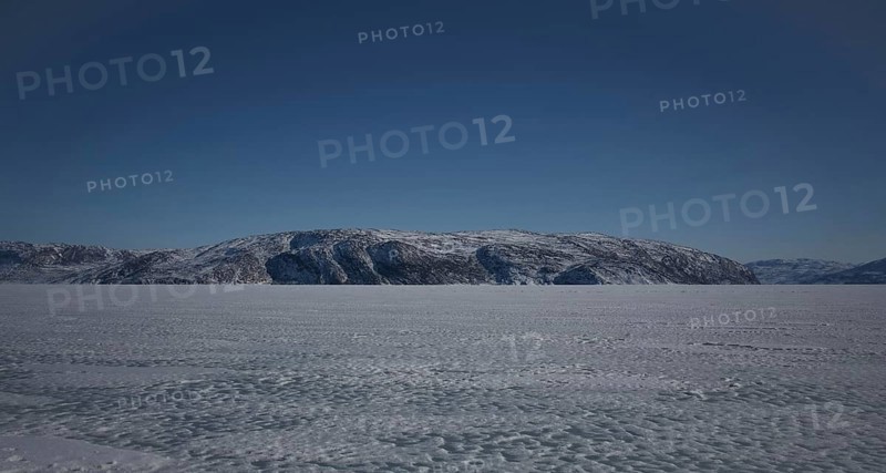 Hill on the shore of the icy fjord Kangerlussuaq