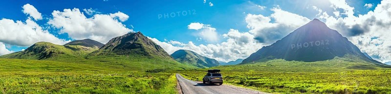 Panorama of Glen Etive and SUV BMW X3 with a roof tent
