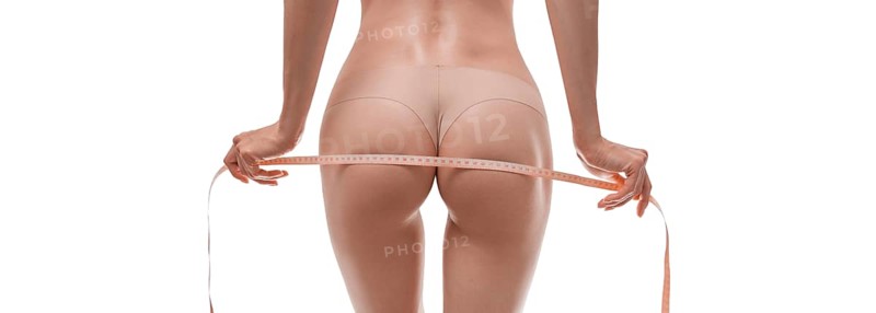 Image of a woman's hips wrapped in a centimeter tape. Medical concept. Anti-cellulite.