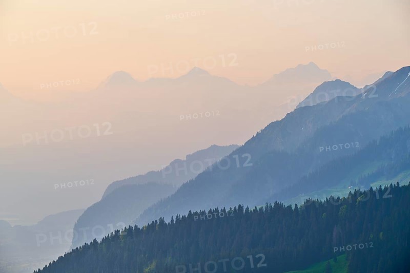 Sunrise over a misty mountain landscape with Eiger