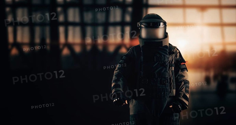 Minesweeper in an armored suit. The concept of anti-terrorism. Airport security. Demining a strategic facility.
