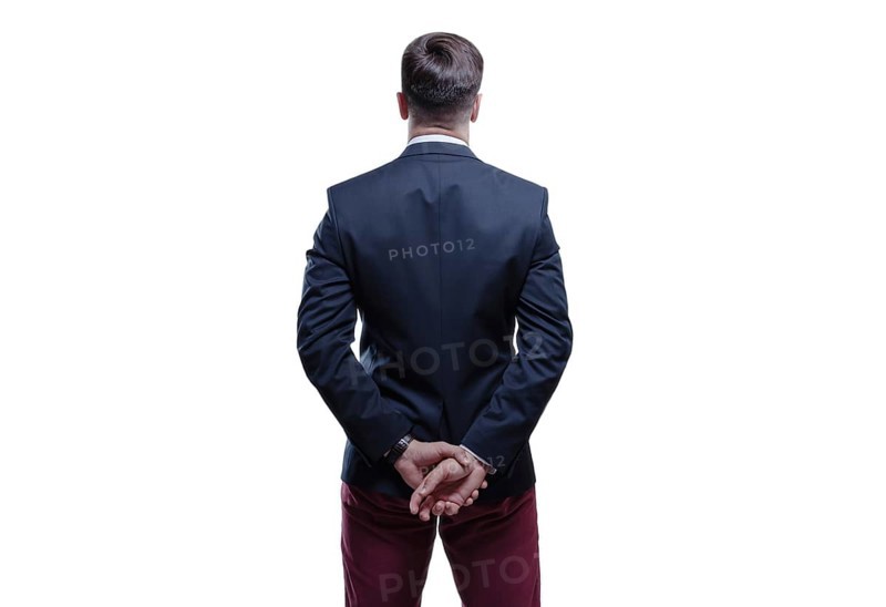 Image of a man in a suit on a white background. Back view. Business concept.