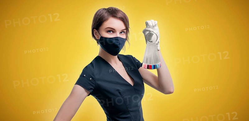 Portrait of an elegant beautiful girl with a set of nail palette in hand. The concept of beauty salons