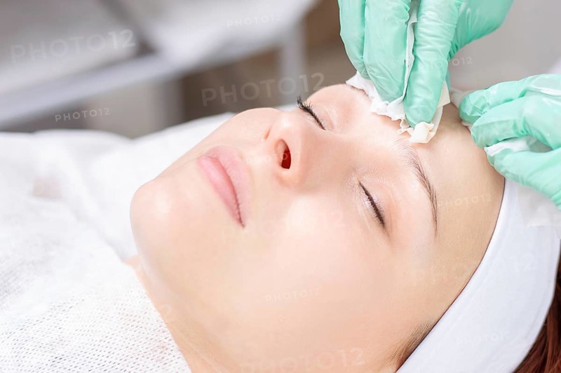 Beautiful girl gets face peeling. Skin health concept. Beauty salons.