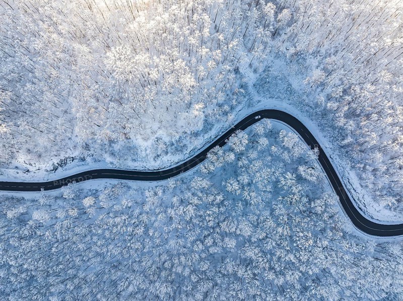 Winding country road near Gutenberg on the Swabian Alb in winter