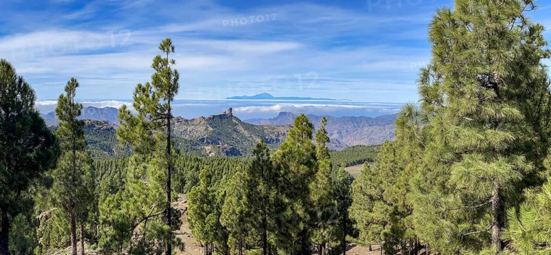 View of Roque Nublo and the Teide mountain peak on the neighbouring island of Tenerife