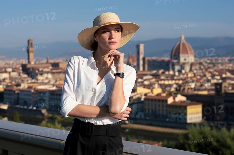 Portrait of a charming girl standing in a square in Florence. View of Santa Maria del Fiore. Tourism concept. Italy.