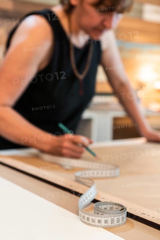 Fashion designer drwaing fashion patterns. Copy space