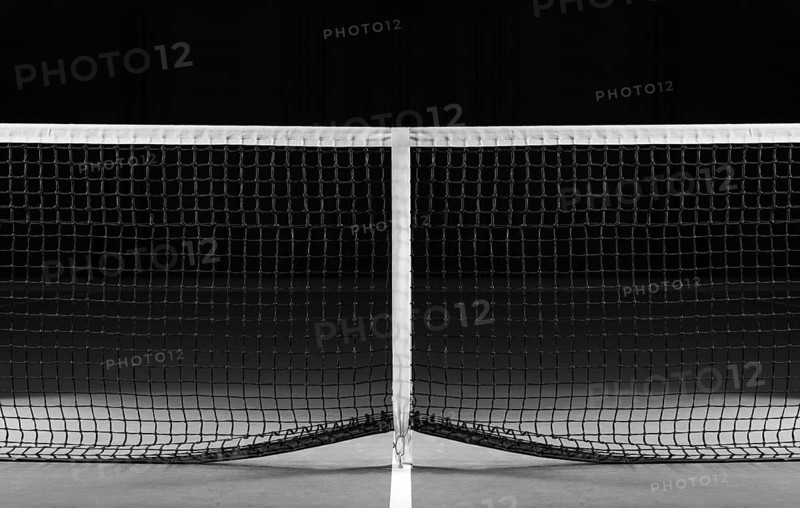 Image of a tennis court with a stretched net. Sports concept.