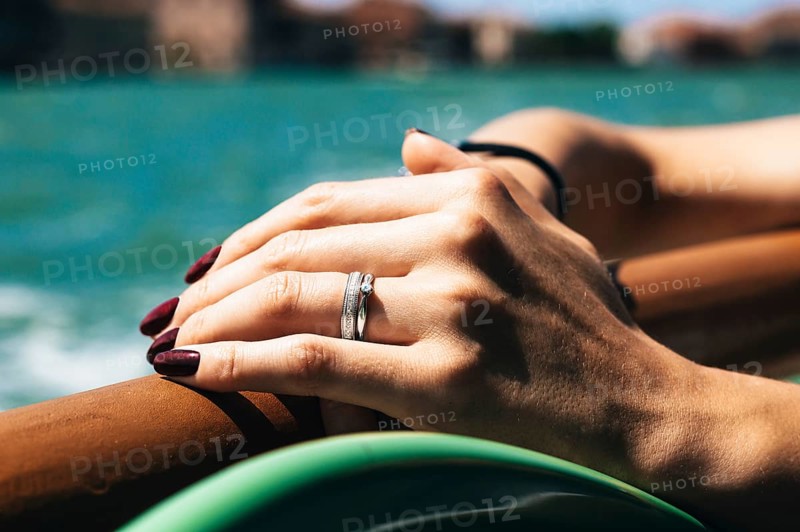 Hand of a girl with a wedding ring. The concept of visiting weddings