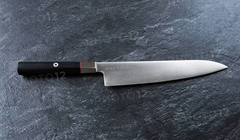Chef's knife from Damascus steel. A real Japanese work of art. View from above