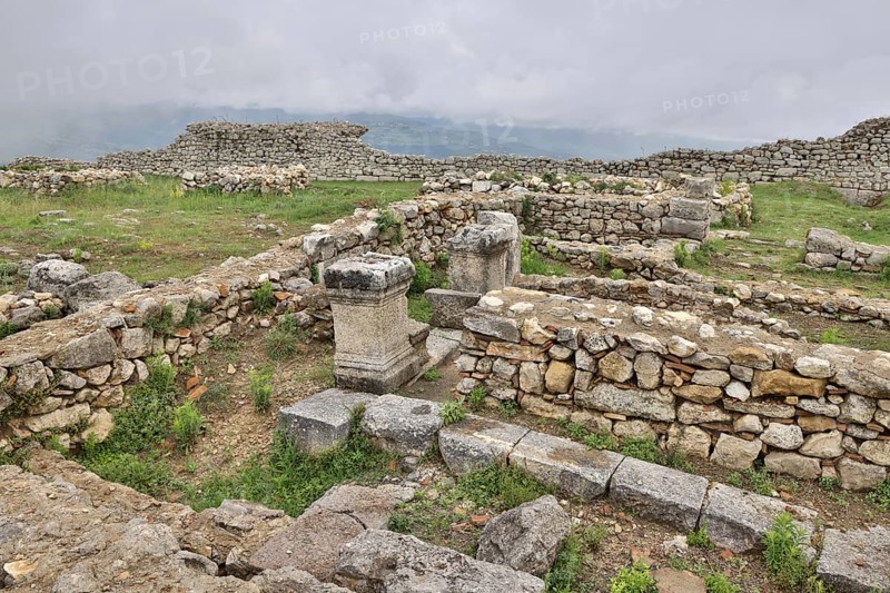 Remains of the Illyrian hilltop settlement of Byllis and view of the VJosa valley