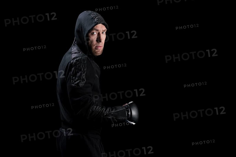 Mixed martial artist goes to battle in a sweatshirt. Concept of mma
