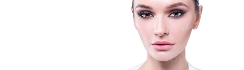 Portrait of a female young face with perfect makeup. The concept of plastic surgery