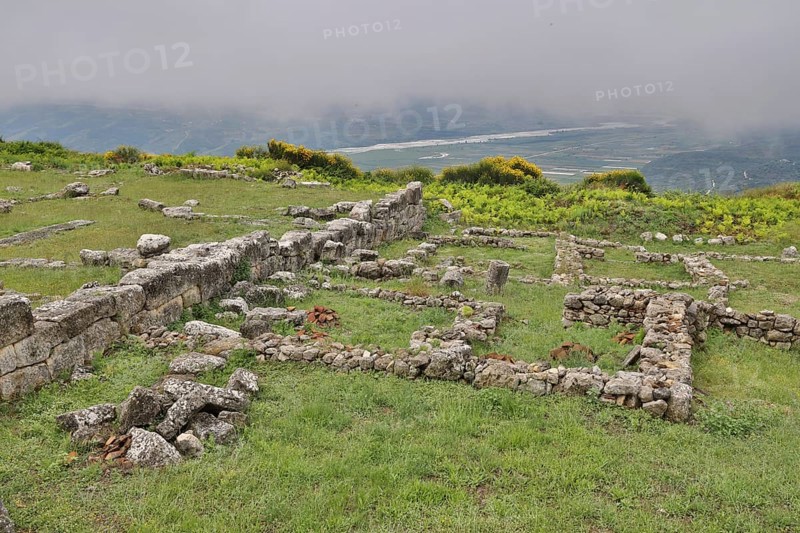 Remains of the Illyrian hilltop settlement of Byllis and view of the VJosa valley