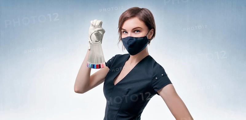 Portrait of an elegant beautiful girl with a set of nail palette in hand. The concept of beauty salons