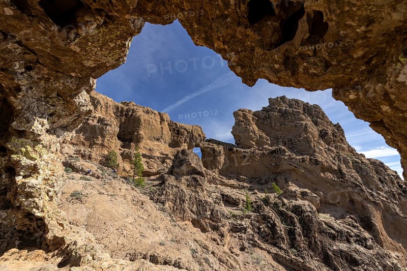 View through rock arch to another rock arch