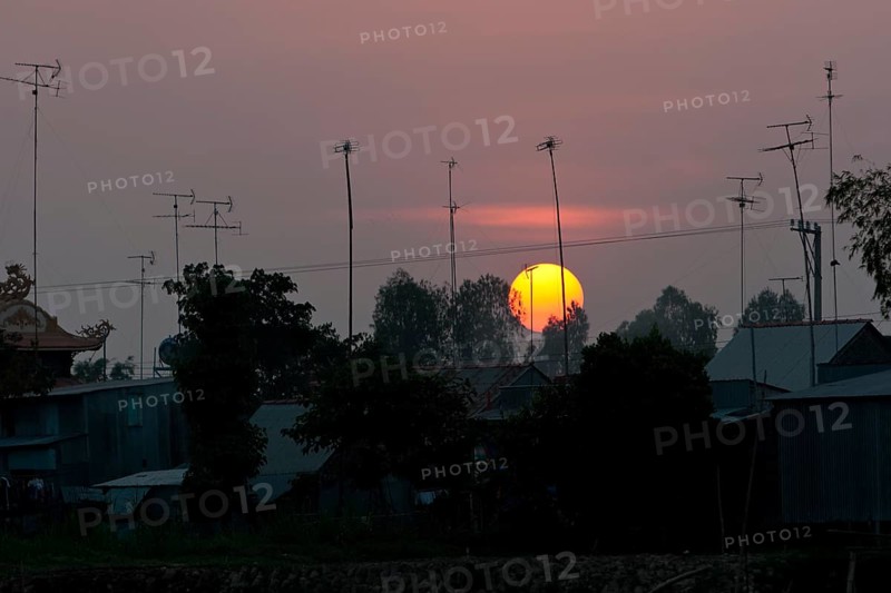 Sunset behind roofs and old television aerials