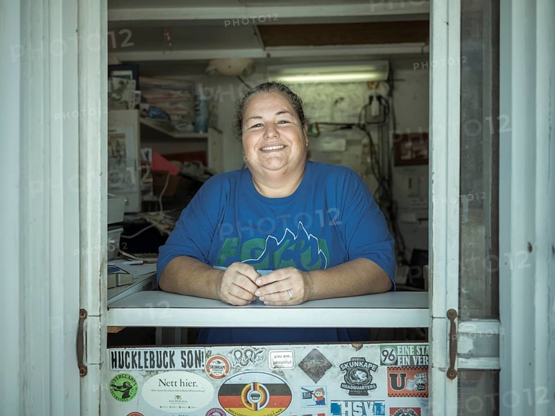 Employee at the counter of the Ochopee Post Office