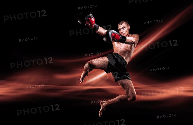 Flying mma fighter. Kickboxing concept. Knee strikes. High quality
