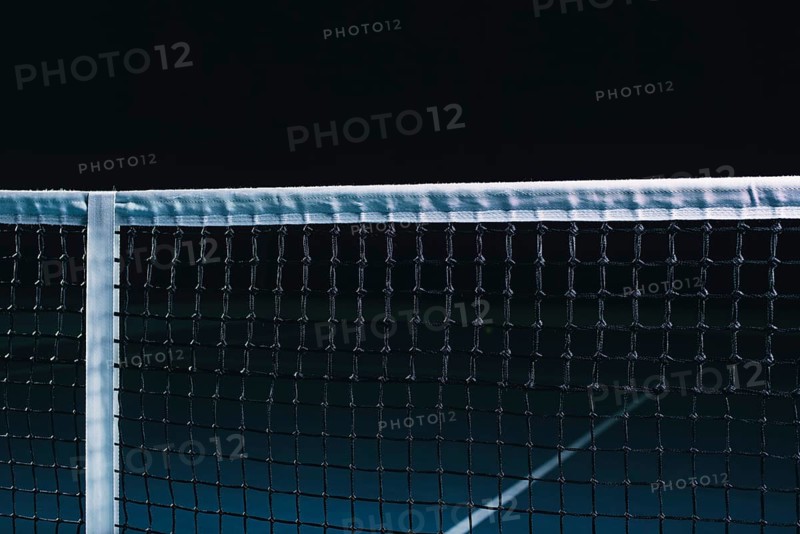 Image of a tennis court with a stretched net. Sports concept.
