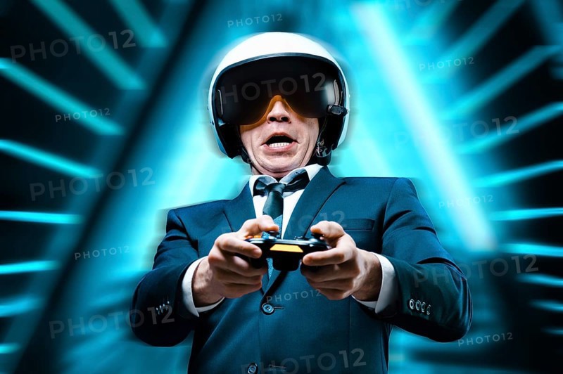 Portrait of an emotional man with a joystick in his hands. ESports. Game concept.
